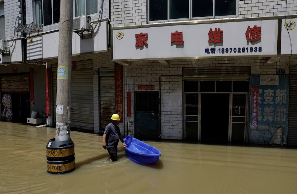 China issues flood and drought warning for 2026 showing high flood risk in northern regions and typhoon movement changes affecting inland cities and major river basins.
