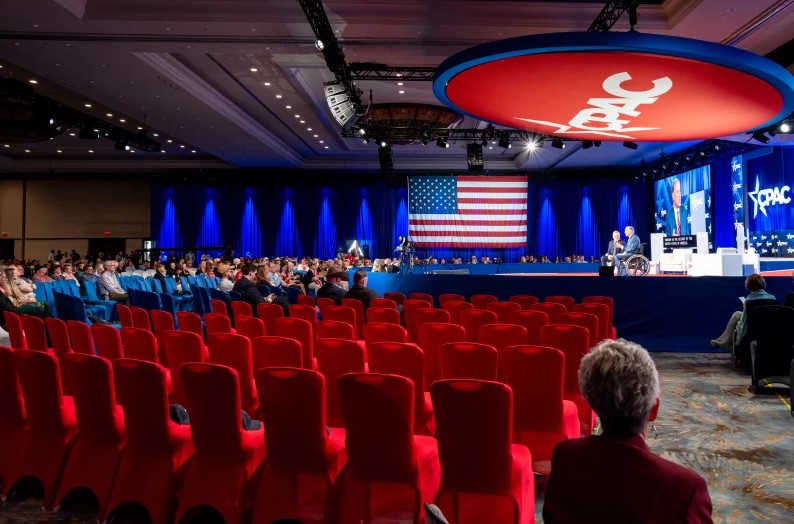 CPAC 2026 conference audience reacting to Iran war debate highlighting generational divide among conservatives