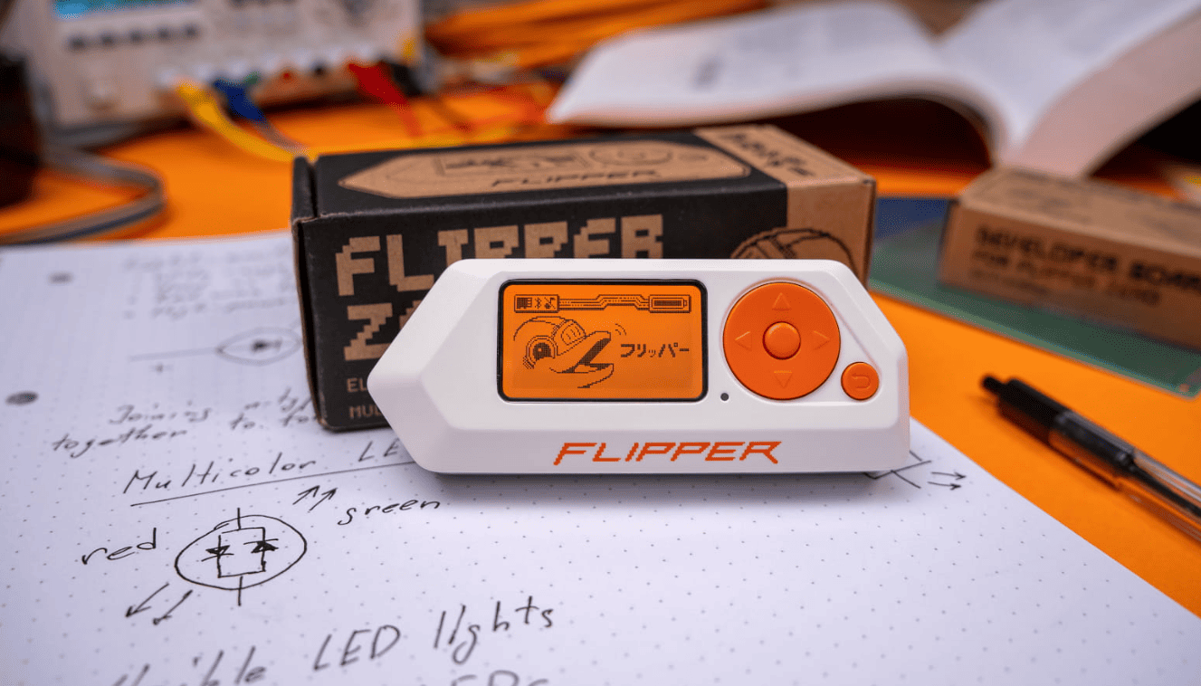 Flipper Zero cybersecurity device on a desk during community-driven firmware development transition.