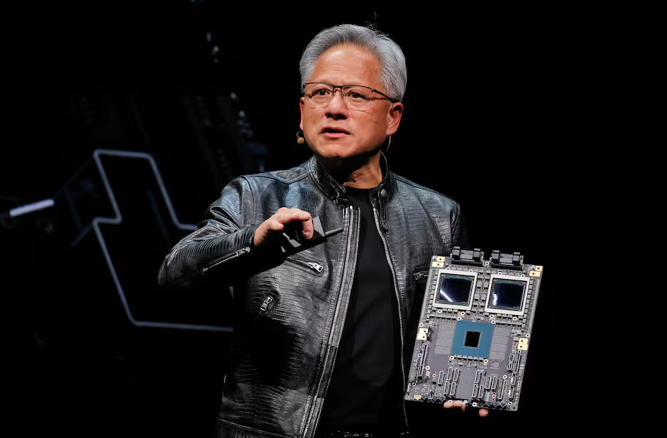 Jensen Huang presenting Nvidia AI chip technology during a keynote on artificial intelligence, semiconductors, and advanced computing.