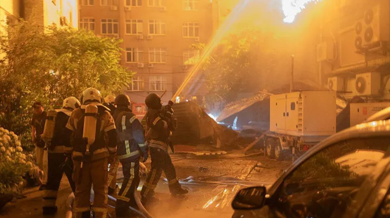 Firefighters respond to fires and damaged buildings after a Russian missile and drone attack struck Kyiv, Ukraine.