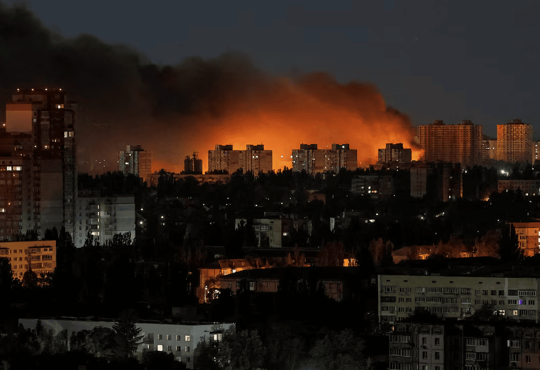 Smoke billows over Kyiv skyline after Russian missile strikes triggered fires during a deadly overnight attack across Ukraine.