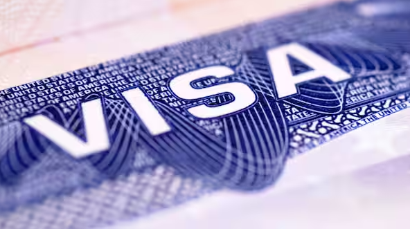 Close-up of a US visa representing the new four-year stay limit for international students under DHS rules.