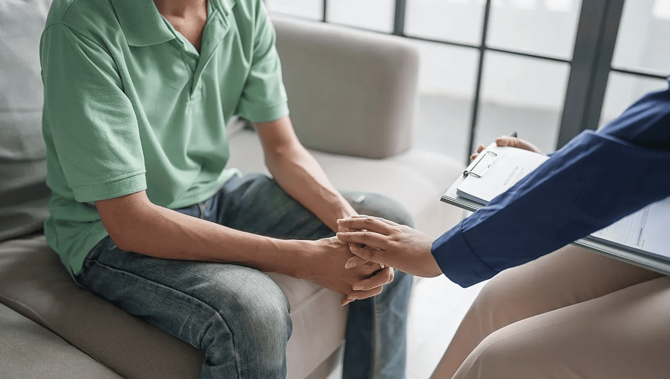 Mental health professional comforting a patient during a counseling session, symbolizing support for anxiety and depression treatment.
